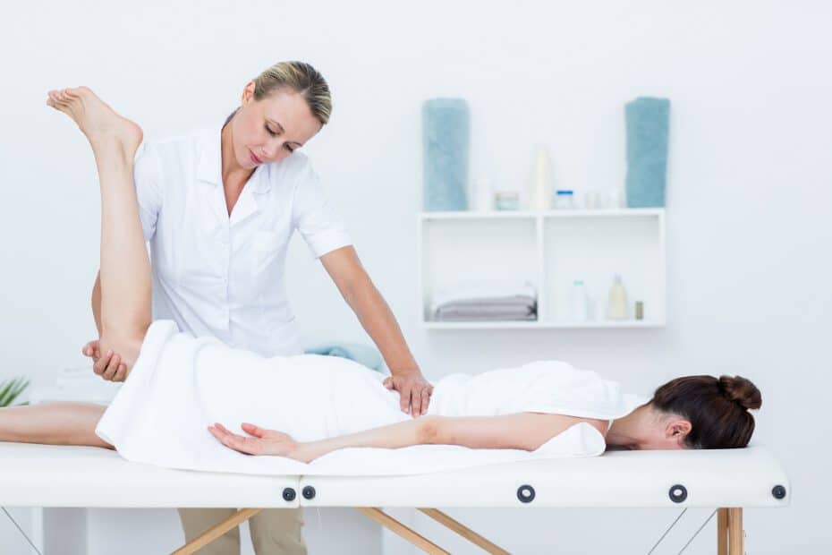 18207122 physiotherapist doing leg massageS
