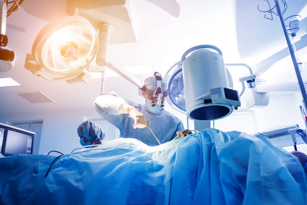 spinal surgery group surgeons operating room with surgery equipment 1