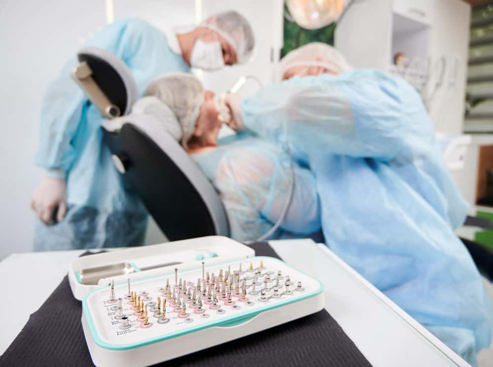 dentist his assistant working with patient dentist chair dentist office 1